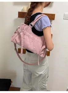 Stylish pink rivet shoulder bag, vintage casual crossbody handbag with metal studs for women.