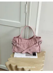 Pink suede underarm shoulder bag with cross straps and metal rivet charms for women summer.