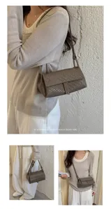 Detail shot of the elegant woven crossbody shoulder bag showcasing its minimalist texture.