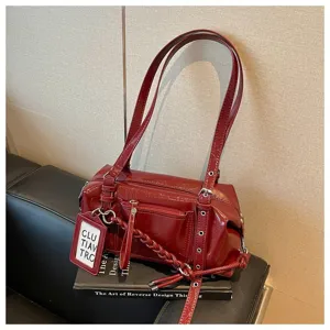 Wine red patent leather shoulder pillow bag, stylish large capacity commuting daily detail view.