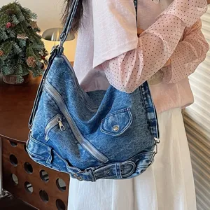Casual large capacity denim shoulder bag for women, retro style with zipper and buckle.