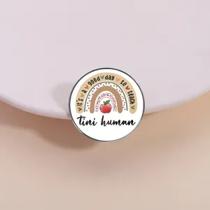 Cute cartoon enamel metal brooch pin with colorful rainbow and apple design for daily wear decoration.