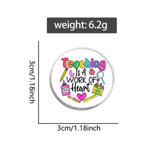 Close-up detail of the metal teacher brooch badge showing clear surface printing and compact size.