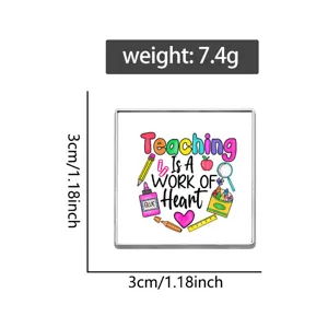 Square teacher brooch badge detail view, metal enamel pin with cute school graphics.