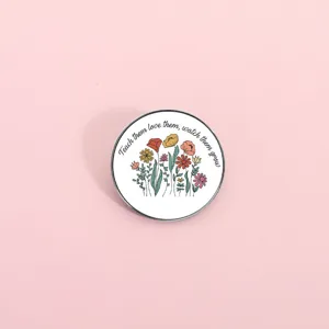 Cute round metal brooch badge with floral illustration and inspirational quote for daily wear