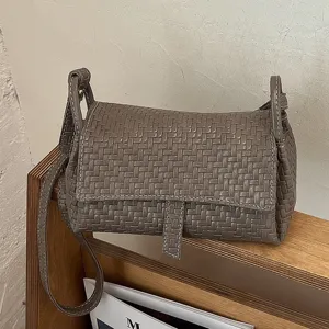 Woven leather crossbody bag for women, trendy chic neutral taupe mini shoulder bag.