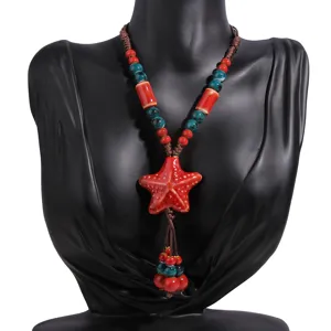 Ethnic ceramic starfish long necklace detail, red and green beads with adjustable cord.