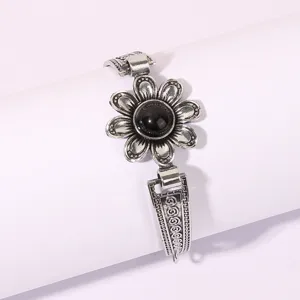 Vintage silver-tone flower bracelet with black stone detailed retro jewelry piece for women.