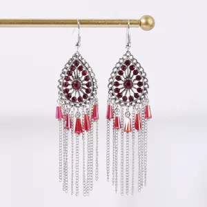 Ethnic bohemian style long tassel earrings with red rhinestones and silver chains.
