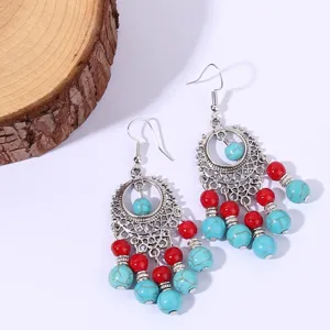 Vintage ethnic bohemian long tassel earrings with turquoise and red beads for women.