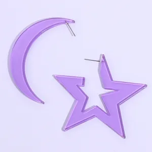 Detail view of purple acrylic star and moon earrings, summer party jewelry accessory.