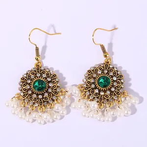 Vintage European court style earrings featuring sparkling rhinestones green gem and faux pearls.