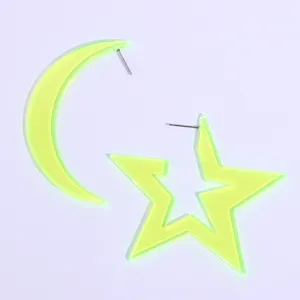 Detailed view of neon yellow acrylic moon and star asymmetrical earrings for summer parties.