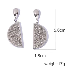 Close-up detail of sparkling rhinestone half-circle lemon pendant earrings with elegant silver finish.