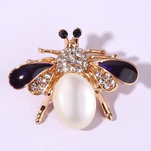 Exquisite gold-plated rhinestone bee brooch featuring purple enamel wings and white opal abdomen.