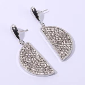 Silver rhinestone lemon slice dangle earrings, sparkling crystal detail, elegant jewelry piece.
