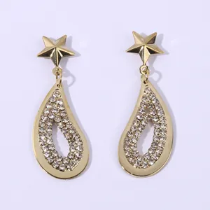 Detailed view of the sparkling gold star and rhinestone teardrop earrings. Elegant design.