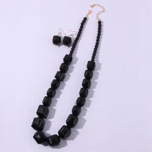 Set di gioielli collana e orecchini con perline geometriche in acrilico nero elegante