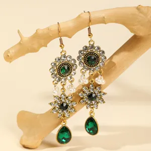 Exquisite baroque green crystal rhinestone dangle earrings, vintage gold-tone metal flower drops.