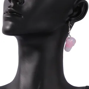 Closeup of cute miniature bubble tea cup dangle earring in pink and white, stylish design.