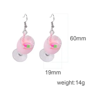 Close-up detail of cute pink milkshake cup resin dangle earrings with metal hooks, 60mm height.