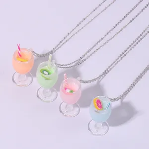 Detail view of summer fruit juice glass pendant necklaces, cute resin charms with silver chains.