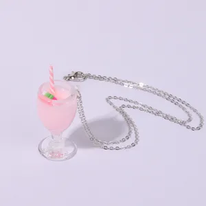 Close-up detail of the cute miniature juice cup pendant on a delicate silver chain necklace.