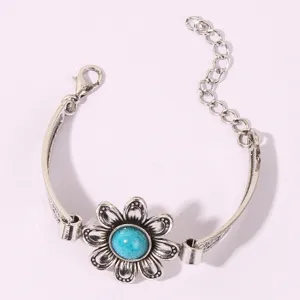 Retro silver flower bracelet with blue turquoise stone, adjustable chain detail view.
