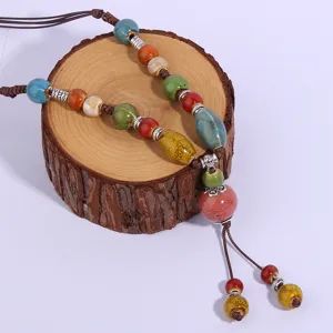 Detailed view of the vintage ethnic ceramic beaded long sweater chain necklace accessory.