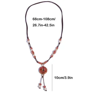 Retro ethnic long sweater chain with handmade ceramic pendant and beads, vintage jewelry.