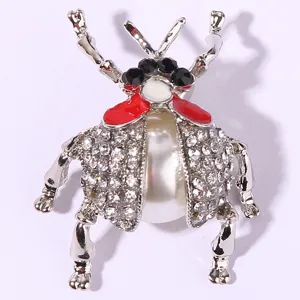 Rhinestone pearl beetle brooch detailed close-up showing intricate crystal inlay design.