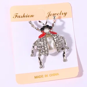 Vintage rhinestone beetle brooch with pearl and enamel, elegant insect pin for women fashion.