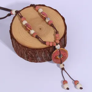 Retro ethnic long ceramic bead sweater chain necklace, handmade bohemian style pendant jewelry.