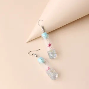 Cute creative drift bottle drop earrings with dried flowers, clear glass vial design for women.