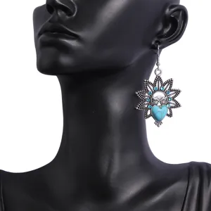 Vintage bohemian style owl dangle earrings with turquoise and blue rhinestones detail view.