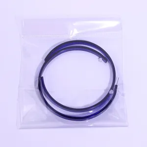 Detail view of large dark blue acrylic hoop earrings, simple and bold fashion accessory.