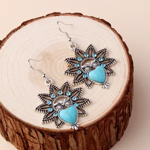 Vintage owl dangle earrings with turquoise heart and blue crystals, bohemian ethnic jewelry details.