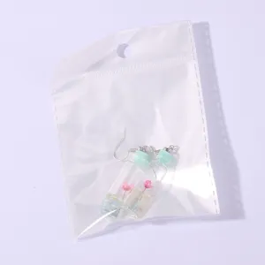 Creative cute drift bottle earrings with pink dry flowers inside clear bag for daily wear style.