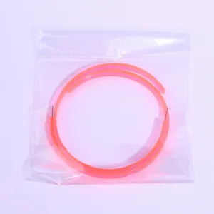 Neon pink acrylic oversized hoop earrings, trendy street style fashion jewelry detail view.