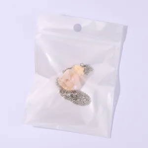 Wish bottle necklace featuring a miniature glass pendant with glitter, delicate chain.