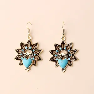 Vintage bohemian owl drop earrings with turquoise heart stones and sparkling rhinestones.