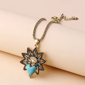 Vintage owl pendant necklace featuring a turquoise heart and blue crystal details for women.