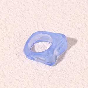 Blue translucent geometric acrylic ring for women, stylish indie resin finger jewelry detail.