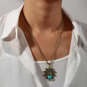 Vintage bronze necklace featuring a stunning turquoise heart sunburst pendant for women accessories.