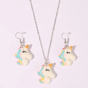 Cute unicorn necklace and earrings set featuring colorful resin pendants and silver-toned chain.