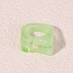 Modern light green geometric acrylic resin ring, trendy chunky style detail view.