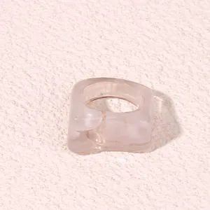 Detailed view of the stylish geometric acrylic resin ring with dual-color swirl design.