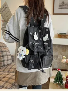 Stylish denim star print backpack with cute wing decor and plush pendant for casual daily use.