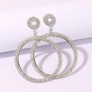 Detailed shot of sparkling rhinestone double hoop earrings, showcasing the intricate crystal pave.