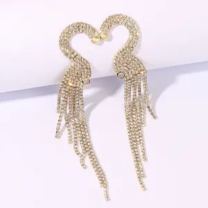Exquisite long rhinestone tassel earrings featuring a stunning swan heart design, perfect for party wear.